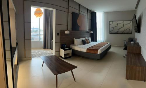 Postel nebo postele na pokoji v ubytování Grand Hotel&Casino Vía Dorada