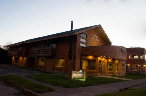 a building with a sign in front of it at Hotel Kernayel in Pucón