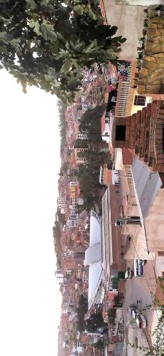 an aerial view of a city with a river at At Nativa in Sucre