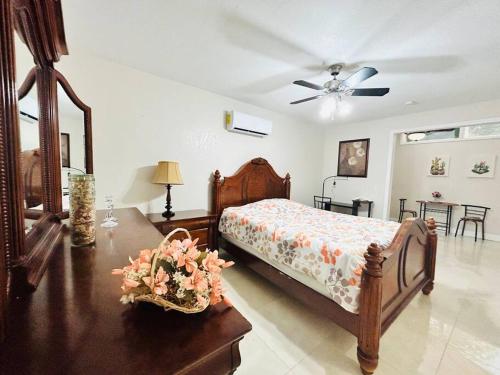 a bedroom with a bed and a table with a fan at Pyramid Studio + free parking&wifi/ 5%off in Tampa