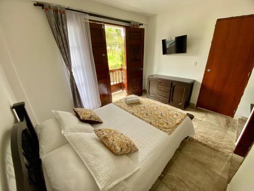 a bedroom with a bed with two pillows on it at Casa Lubel in Salento