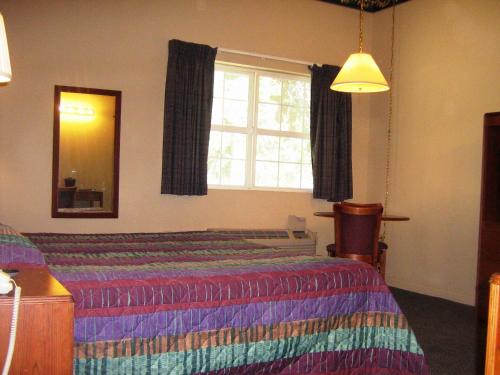 Un ou plusieurs lits dans un hébergement de l'établissement Westhaven Inn