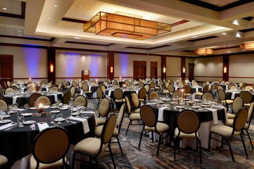 a ballroom with tables and chairs in a room at Wyndham Atlanta Buckhead Hotel & Conference Center in Atlanta