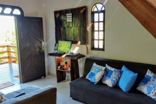 TV a/nebo společenská místnost v ubytování Casa rustica de Praia em Cumuruxatiba-BA