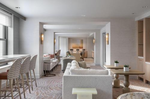a lobby with couches and tables and chairs at The Westin Book Cadillac Detroit in Detroit