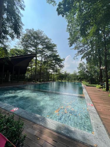 a swimming pool in the middle of a forest at Forest Villa at Dai Lai Resort in Ngọc Quang