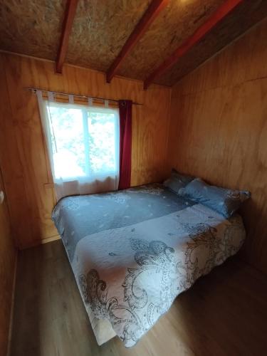 Giường trong phòng chung tại Cabañas Vista al mar