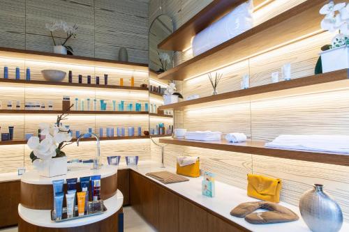 a store with a counter with a lot of products at The Westin Santa Fe, Mexico City in Mexico City