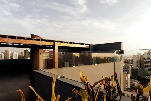 a building with a view of a city at Excellent apartment, access to pool, grills, ballroom in Lima