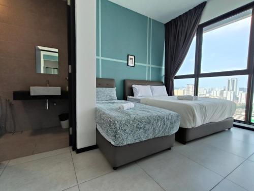 a bedroom with two beds and a sink and a window at New 2BR or 3BR Homey Getaway stay 7 to 10 pax at Urban Suites, Georgetown by URBAN STAYCATION LOD in Jelutong