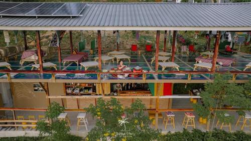an overhead view of a house with tables and chairs at SZ Samui Glamping in Ban Sa Ket
