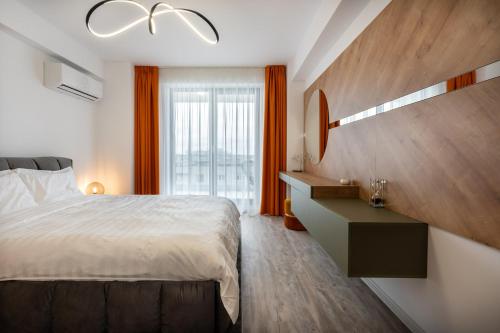 a bedroom with a large bed and a large window at Classy Sassy I Timpuri Noi in Bucharest
