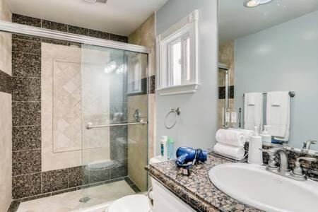 a bathroom with a shower and a sink at AWESOME 3BR 1 Block To Ocean Fast WIFI C1 in Newport Beach