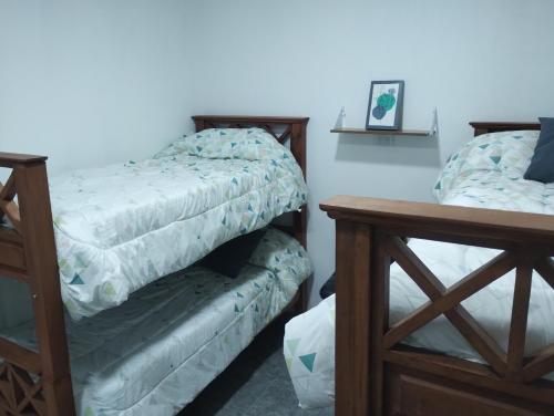 Posteľ alebo postele v izbe v ubytovaní Nanai