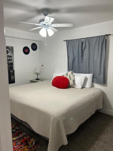a bedroom with a bed with a ceiling fan at Red Hen Rental - 2 bed with 1 FULL bath 1 HALF bath FULL Kitchen in Cedar City