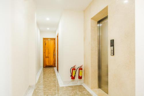 a hallway with two fire hydrants on the wall at H Hotel in Quy Nhon
