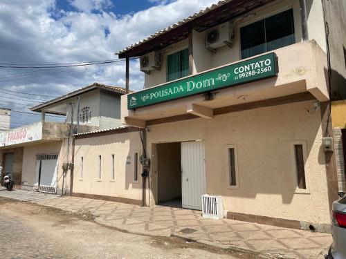 a building with a sign on the side of it at Apto Light pulse in Campos dos Goytacazes