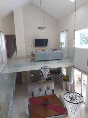 a living room with a glass table and chairs at VP18, Lifestyle All Inklusive , Villapark in Gurapito