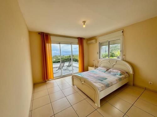 Postel nebo postele na pokoji v ubytování Villa Maryam avec piscine avec vue mer