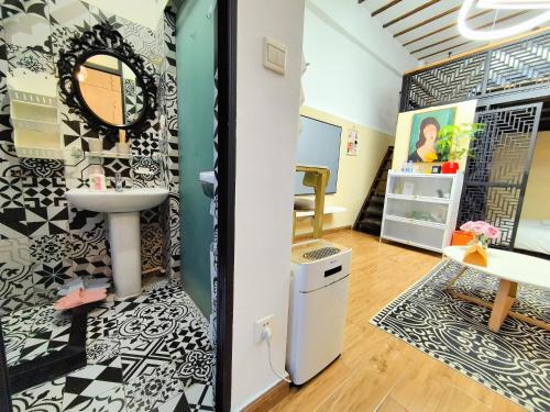 a bathroom with a sink and a mirror on a wall at Shanghai Hills & Zinn Happy Family Bnb Near Line1&14 South Huangpi Rd Mid Huaihai Rd in Shanghai