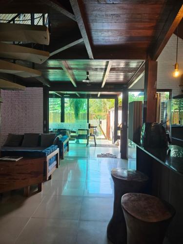 a living room with a couch and a table at Charme do Chalé 17 em Gravatá in Gravatá