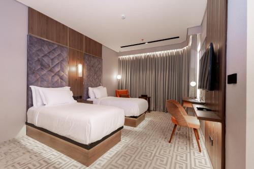 Postel nebo postele na pokoji v ubytování Damask Hotels