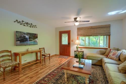a living room with a couch and a table at Hillside Hideaway in Logan