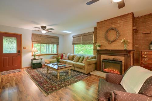 a living room with a couch and a fireplace at Hillside Hideaway in Logan