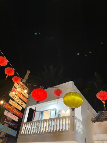 two red and yellow lanterns hanging over a building at Bãi Xếp Beach in Quy Nhon