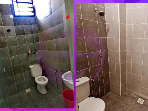 パダンセライにあるThe Clemira Homestay @ Sungai Karangan, Kulim, Kedahのバスルーム(トイレ、紫色の照明付きシャワー付)
