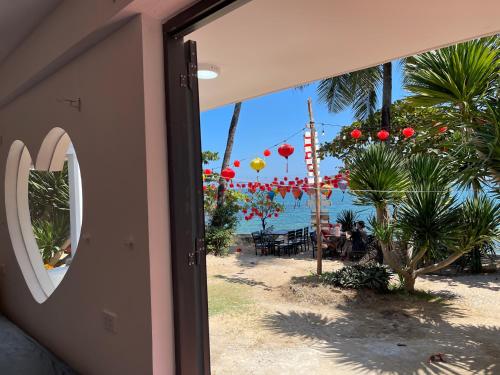 a door to a beach with a view of the ocean at Bãi Xếp Beach in Quy Nhon