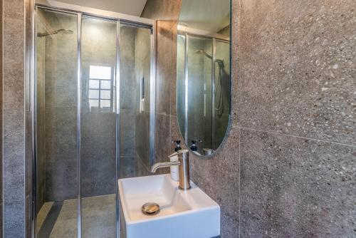 a bathroom with a sink and a shower at K2 Brisbane in Brisbane