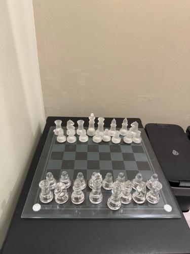 a chess board with chess pieces on a chessboard at Logement de Ville 4 chambres proche de Lille in Tourcoing
