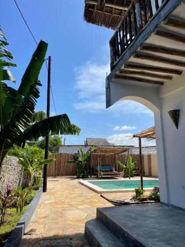 a view of a house with a swimming pool at Chunga Changa in Matemwe