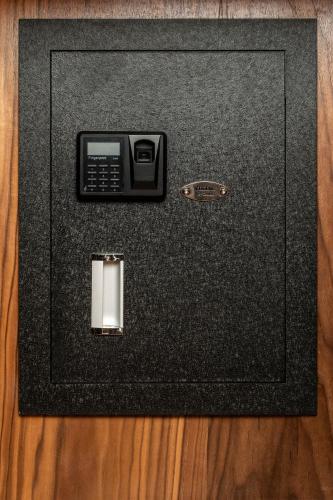 a black screen with a tv on top of a wooden floor at OBO Casa • Modern Lux Design Loft • Ipanema Beach in Rio de Janeiro