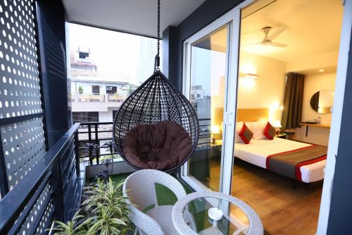 a room with a hammock on a balcony at BK Studio And Rooms Near Huda City Centre in Gurgaon