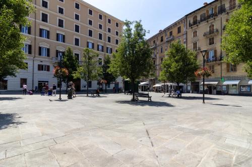 a large plaza in a city with buildings at Cinque Terre Gateway in La Spezia