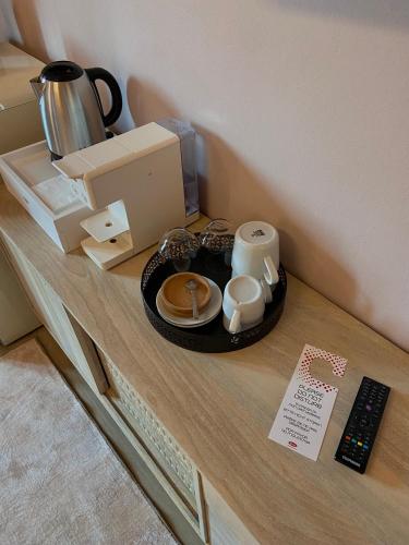 a table with a tray of food and coffee on it at YOLE Affittacamere in Empoli