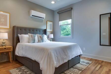 a bedroom with a large bed and a window at The Cleveland - Chic Home, Walk to Restaurants in Nashville