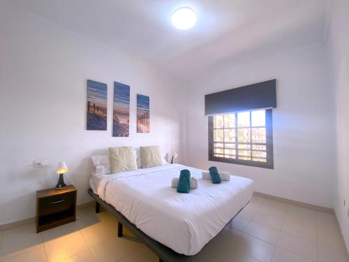 En eller flere senge i et værelse på Tropicalidays Costa Mar