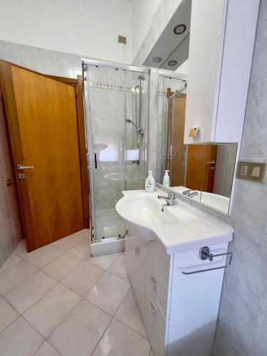 a bathroom with a sink and a shower at Casa di Jack I.U.N. R6217 in Quartu SantʼElena