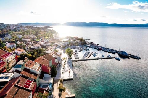 an aerial view of a marina with boats in the water at Apartment Tara in Njivice