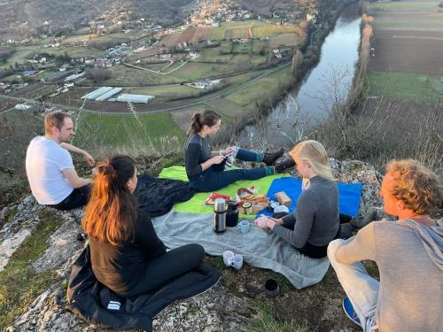 a group of people sitting on top of a mountain at Domaine Mas de Galy in Saujac