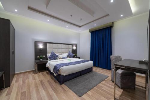 Postel nebo postele na pokoji v ubytování عماره هوليداي المروة- Holiday Al Marwa Building