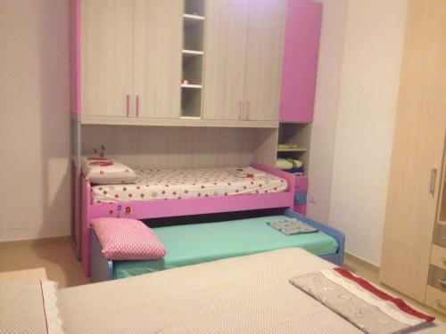 Postel nebo postele na pokoji v ubytování Beachfront Apartment