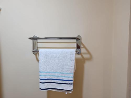 a towel hanging on a towel rack in a bathroom at Verishen Guest House B&B in Goris