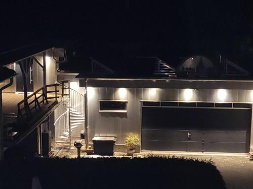 a house with lights on the side of it at night at Ferienwohnung oder Studio Dresden-Neustadt inkl Parkplatz mit Balkon oder Terrasse in Dresden