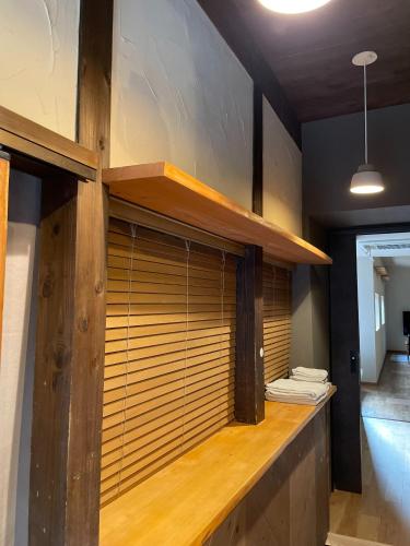 a room with a counter with wooden blinds at etoile inn sumoto - Vacation STAY 49252v in Sumoto