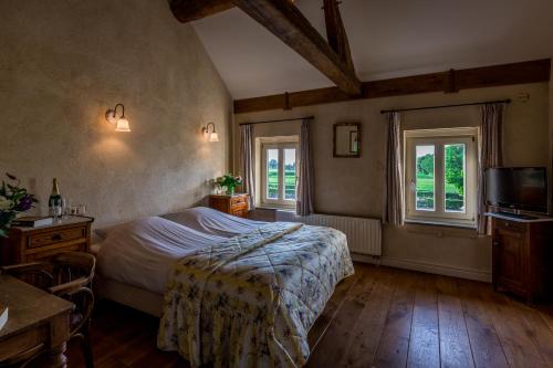 Ліжко або ліжка в номері Auberge de Smockelaer