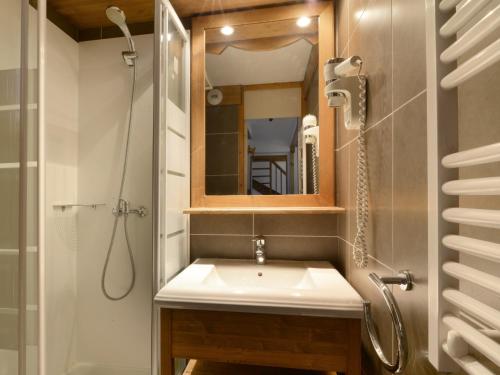 a bathroom with a sink and a shower and a mirror at Appartement rénové proche station avec balcons et vue, 3 ch, 10 pers - FR-1-181-2457 in La Plagne Tarentaise